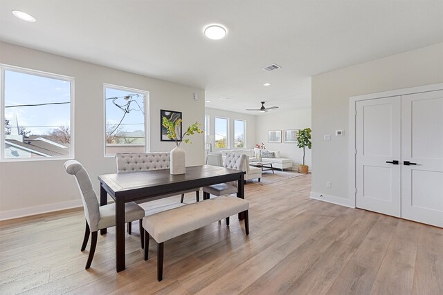 dining space with a ceiling fan, baseboards, visible vents, recessed lighting, and light wood-type flooring