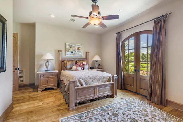 bedroom with visible vents, light wood-style flooring, french doors, baseboards, and access to exterior