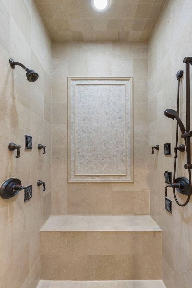 bathroom featuring tiled shower