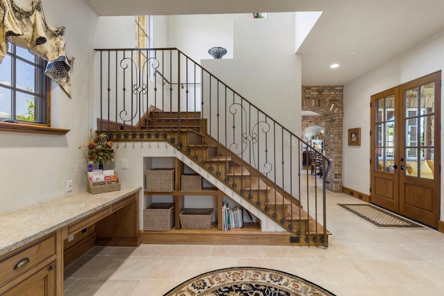 entrance foyer featuring stairs, recessed lighting, french doors, and a wealth of natural light