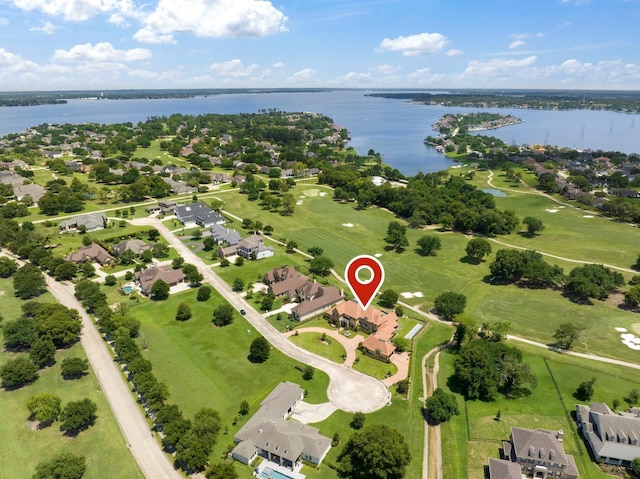 drone / aerial view with a residential view and a water view