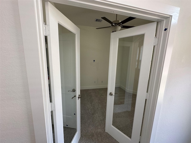 hall featuring visible vents, french doors, and carpet floors