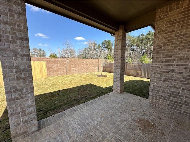 view of yard featuring a fenced backyard and a patio