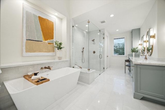 full bath featuring visible vents, a shower stall, recessed lighting, a soaking tub, and vanity