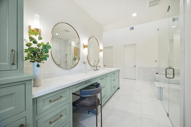 bathroom with visible vents, vanity, and a shower stall