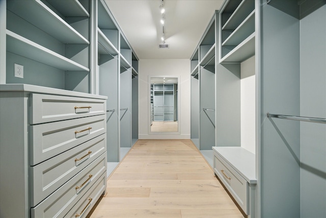 spacious closet with visible vents and light wood-type flooring