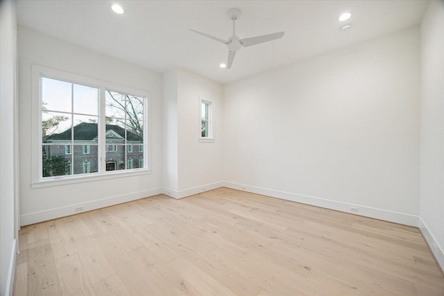 spare room with recessed lighting, baseboards, light wood-style floors, and ceiling fan