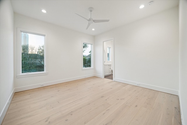 unfurnished room with light wood finished floors, recessed lighting, baseboards, and ceiling fan