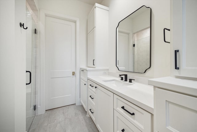 bathroom featuring vanity and a shower stall