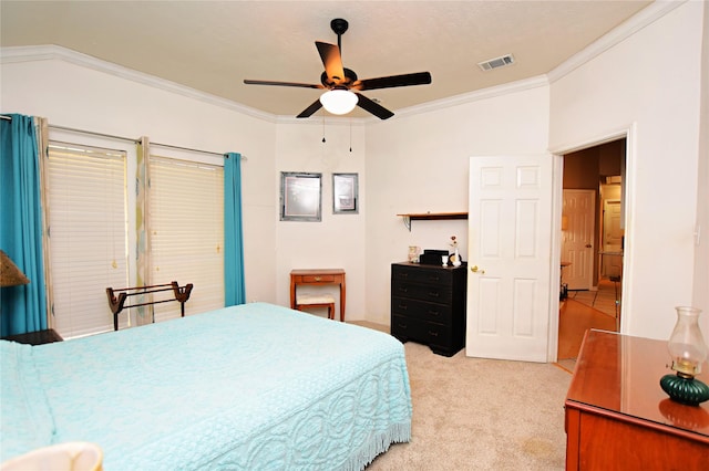 bedroom featuring visible vents, light colored carpet, ornamental molding, and a ceiling fan