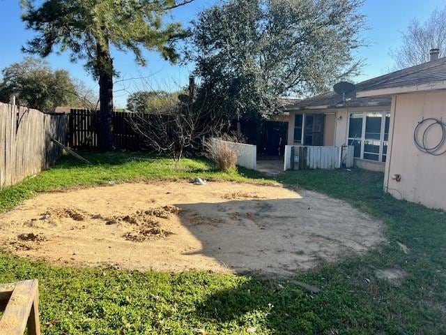 view of yard with a fenced backyard and a patio area