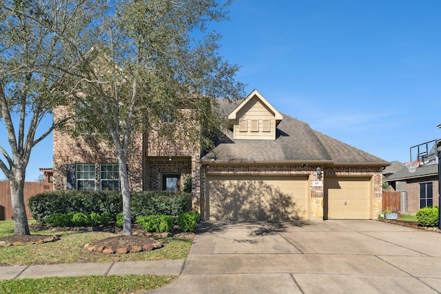 view of front facade with brick siding, driveway, a garage, and fence