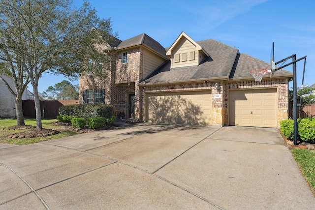 view of front facade featuring fence, driveway, roof with shingles, a garage, and brick siding