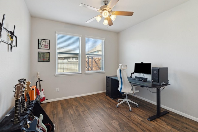 office space featuring ceiling fan, baseboards, and wood finished floors