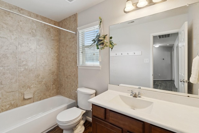 full bathroom with tub / shower combination, visible vents, toilet, and vanity