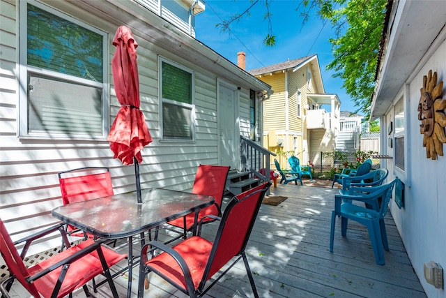 wooden deck featuring outdoor dining space