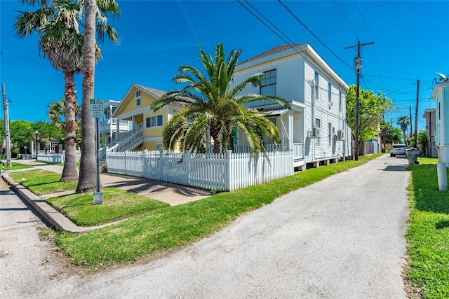 view of building exterior featuring a fenced front yard