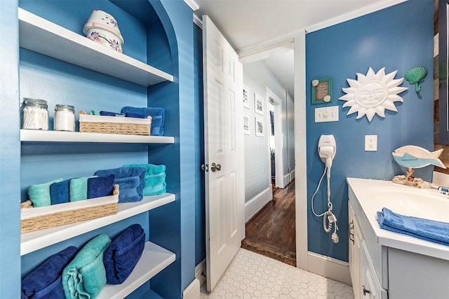 bathroom with vanity and baseboards