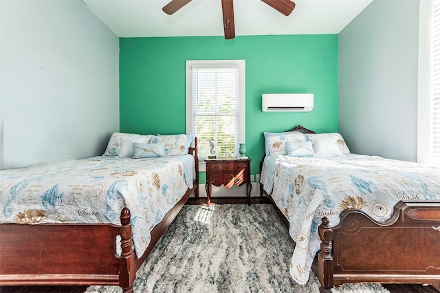 bedroom with an AC wall unit and ceiling fan