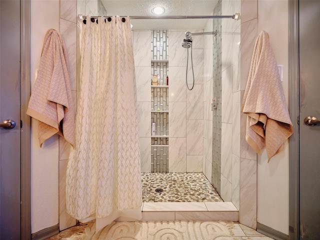 full bath with a walk in shower and a textured ceiling