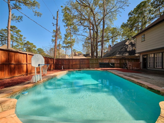 view of pool featuring a patio area, a fenced backyard, and a fenced in pool