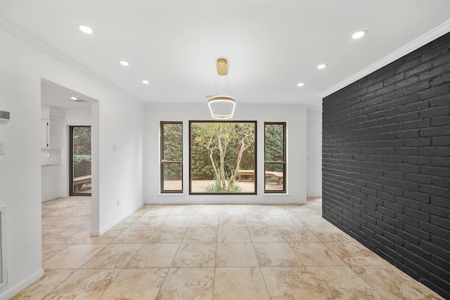 unfurnished room featuring recessed lighting, baseboards, brick wall, and ornamental molding