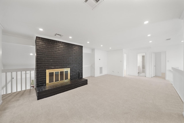 unfurnished living room with recessed lighting, visible vents, a brick fireplace, and carpet flooring