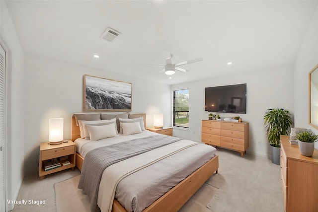 bedroom with a ceiling fan, recessed lighting, light colored carpet, and visible vents