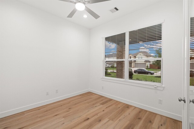 16174 Rustling Woods Rd, Conroe, TX 77302 - unfurnished room with baseboards, light wood-style flooring, recessed lighting, and a ceiling fan
