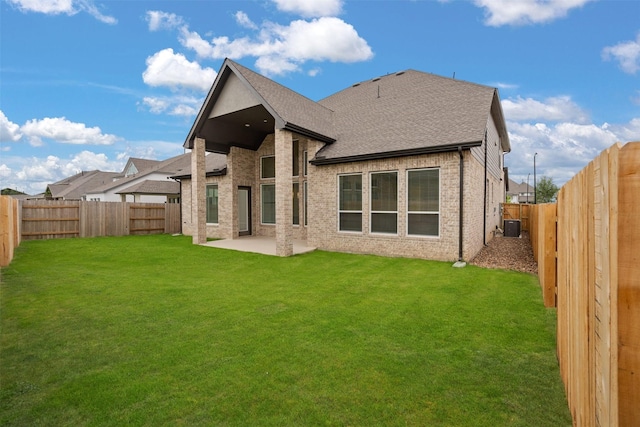 16174 Rustling Woods Rd, Conroe, TX 77302 - rear view of property featuring a patio area, central AC unit, roof with shingles, and brick siding
