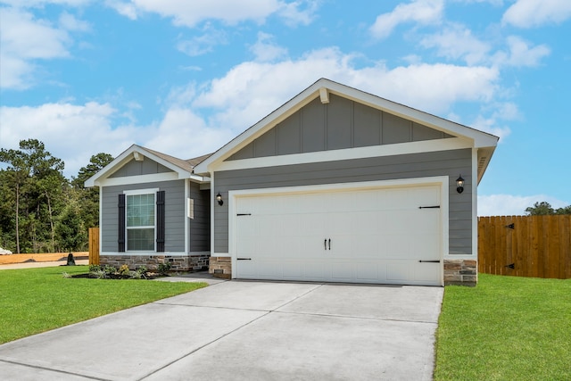 view of front of property with stone siding, board and batten siding, concrete driveway, and a front yard