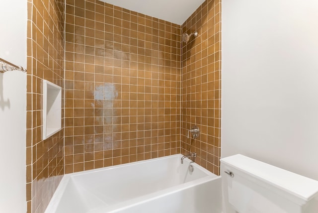 bathroom featuring toilet and bathtub / shower combination