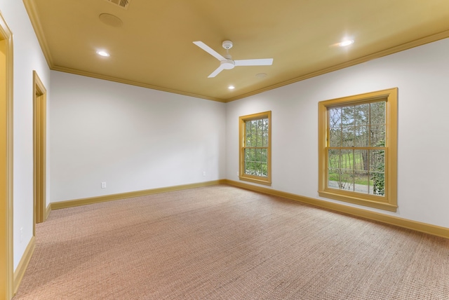 empty room with carpet flooring, baseboards, ceiling fan, and ornamental molding