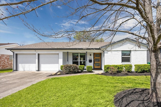 single story home with a front yard, a shingled roof, concrete driveway, a garage, and brick siding