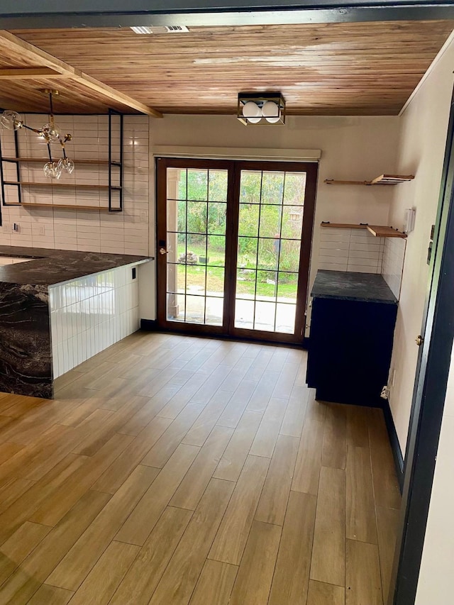 interior space with wood ceiling and wood finished floors