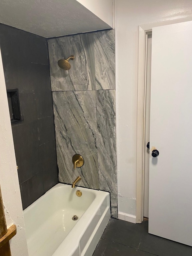 bathroom featuring a textured ceiling and  shower combination