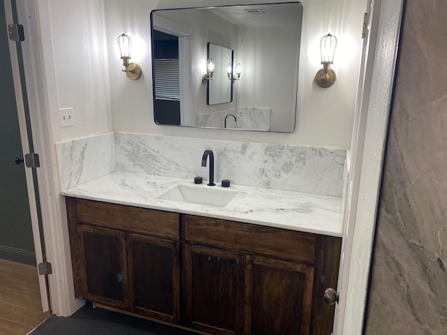 bathroom featuring vanity and wood finished floors