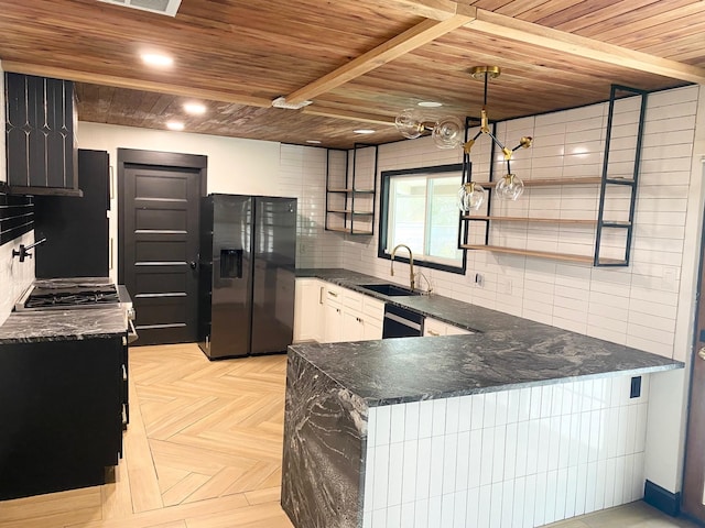 kitchen featuring black appliances, a sink, backsplash, a peninsula, and wood ceiling