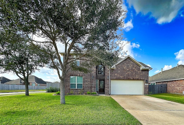 traditional-style house featuring brick siding, fence, a front yard, a garage, and driveway