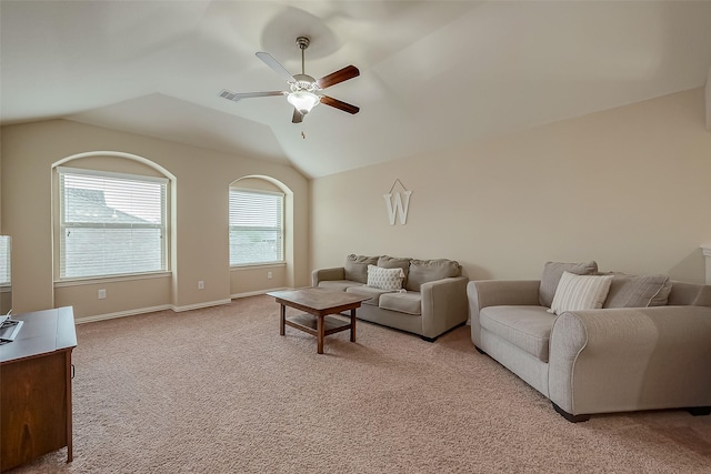 living room featuring visible vents, baseboards, light colored carpet, ceiling fan, and vaulted ceiling