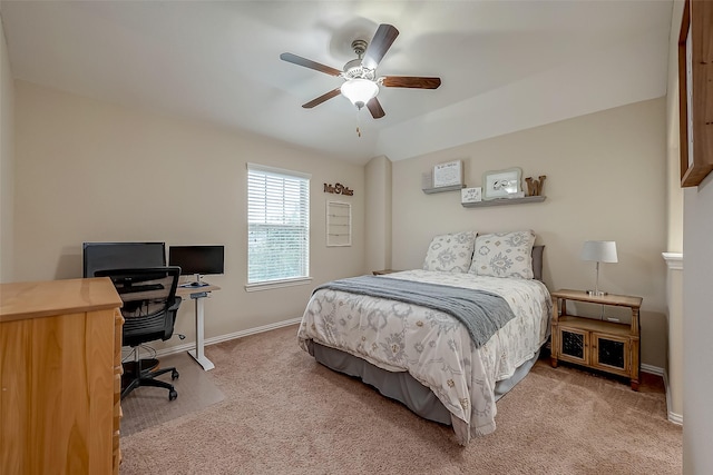 carpeted bedroom with ceiling fan and baseboards