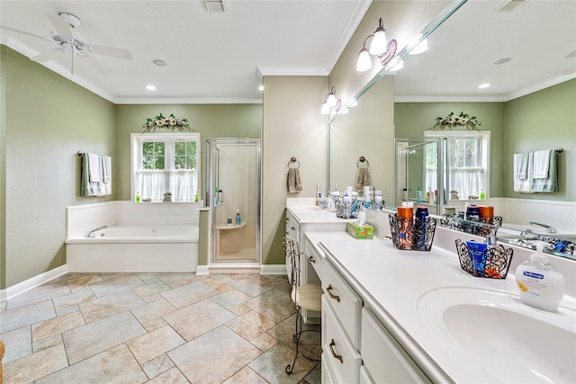 bathroom with vanity, a garden tub, crown molding, and a stall shower