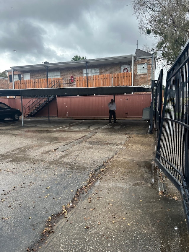 view of parking featuring fence