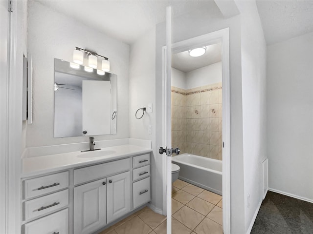 full bathroom with baseboards, toilet, bathing tub / shower combination, tile patterned floors, and vanity