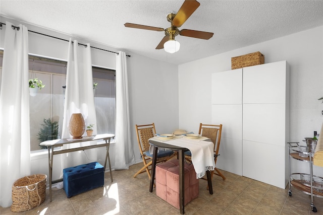 dining space with a textured ceiling