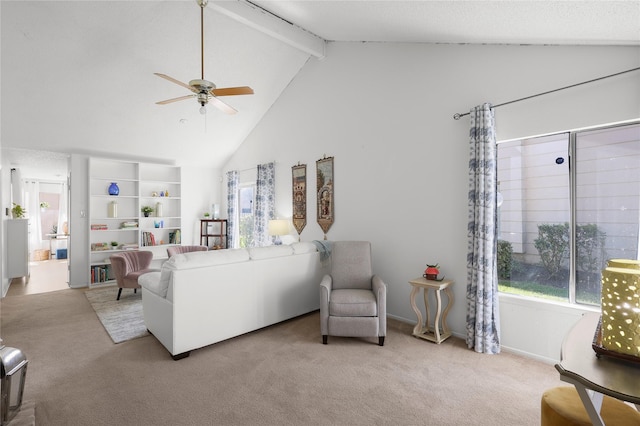 carpeted living area with beamed ceiling, a ceiling fan, and high vaulted ceiling