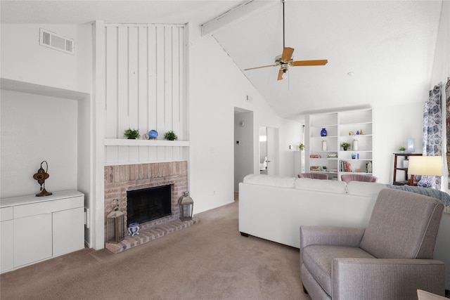 living area with a ceiling fan, visible vents, high vaulted ceiling, a fireplace, and light carpet