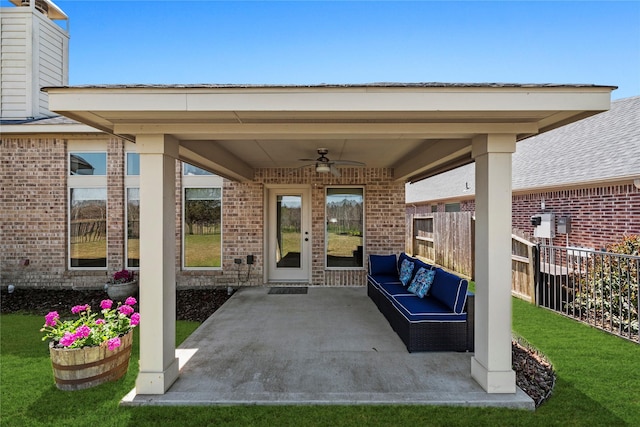 view of patio featuring ceiling fan, outdoor lounge area, and fence