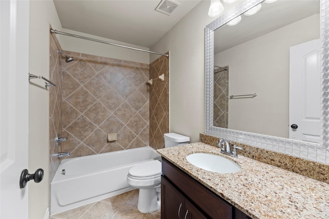 bathroom featuring visible vents, toilet, shower / tub combination, tile patterned floors, and vanity