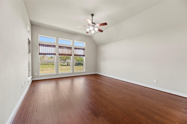 unfurnished room featuring a ceiling fan, baseboards, and dark wood-style flooring